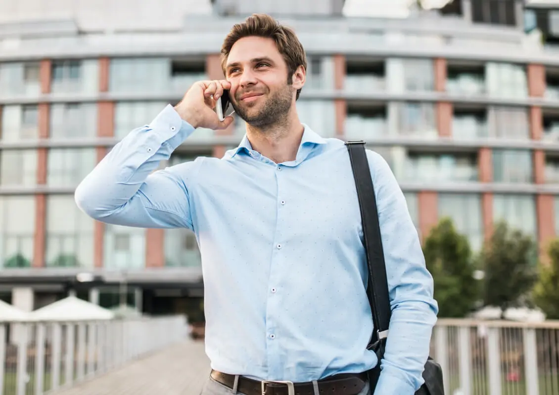 young man on cellphone outside