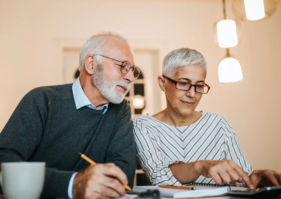 middle aged couple reviewing finances