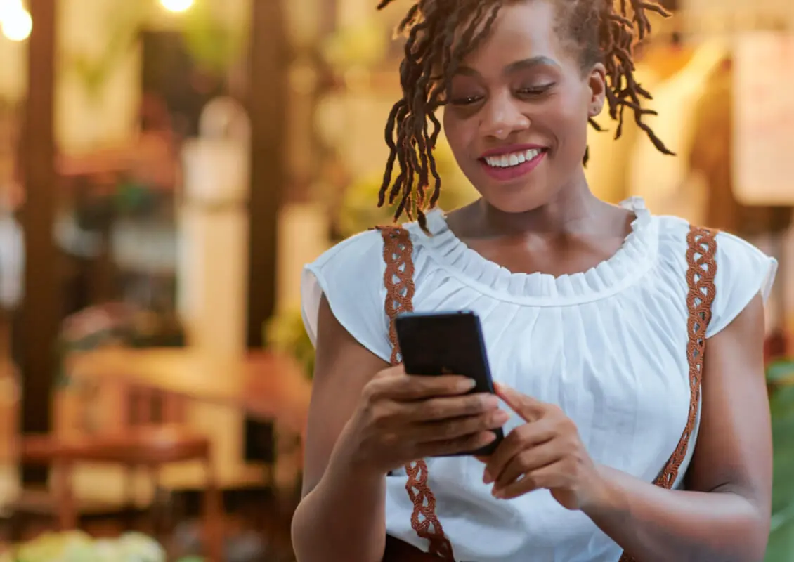 happy woman using cellphone