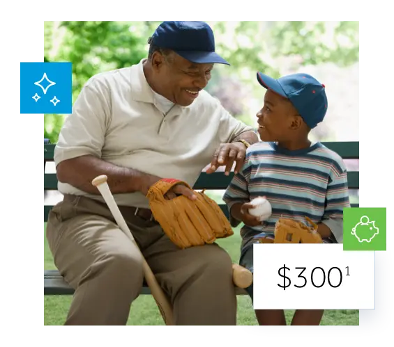 Grandfather and grandson sitting on a bench with baseball bats, gloves and hats.